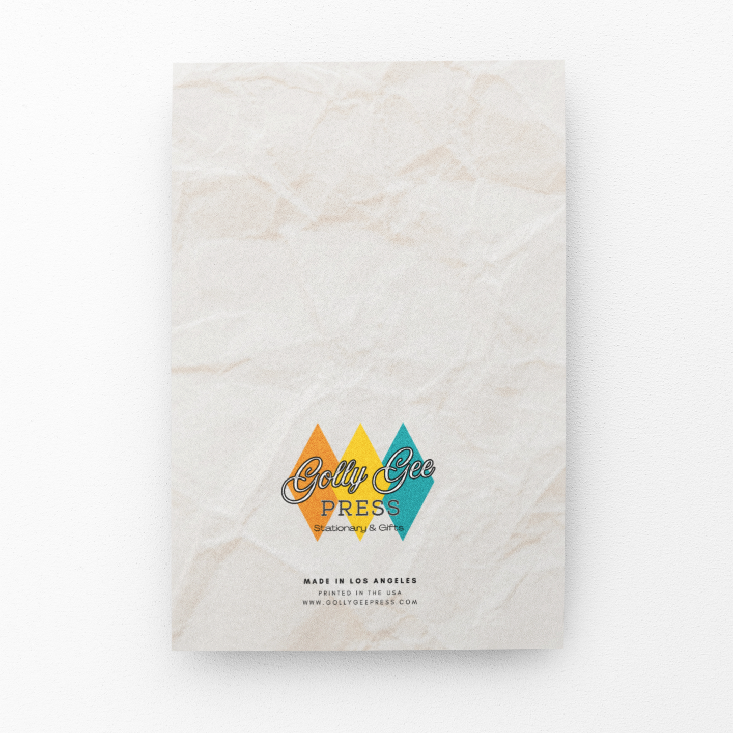 Marble notebook with colorful logo and text on a white background